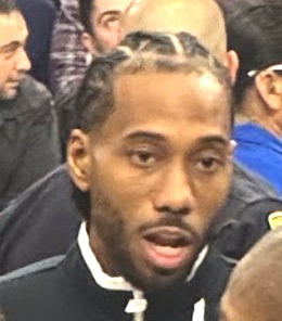 Kawhi Leonard courtside at an arena