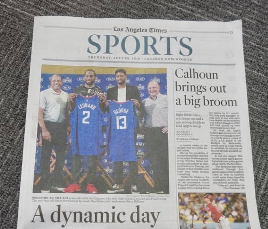 Los Angeles Times sports front page from July 25, 2019, showing Kawhi Leonard and Paul George holding Clippers jerseys at their introductory news conference
