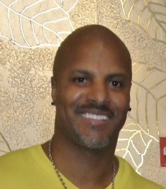Ken Norman smiling toward the camera